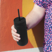 Fellow Carter Cold Tumbler in matte stainless steel with reusable straw, ceramic-coated interior, and spill-resistant lid. Available in 16 oz size.