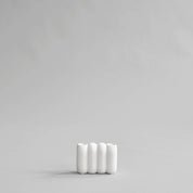 101 Copenhagen Tube Candleholder Mini in bone white hand-glazed ceramic with sculptural lamella design, holds two candles.