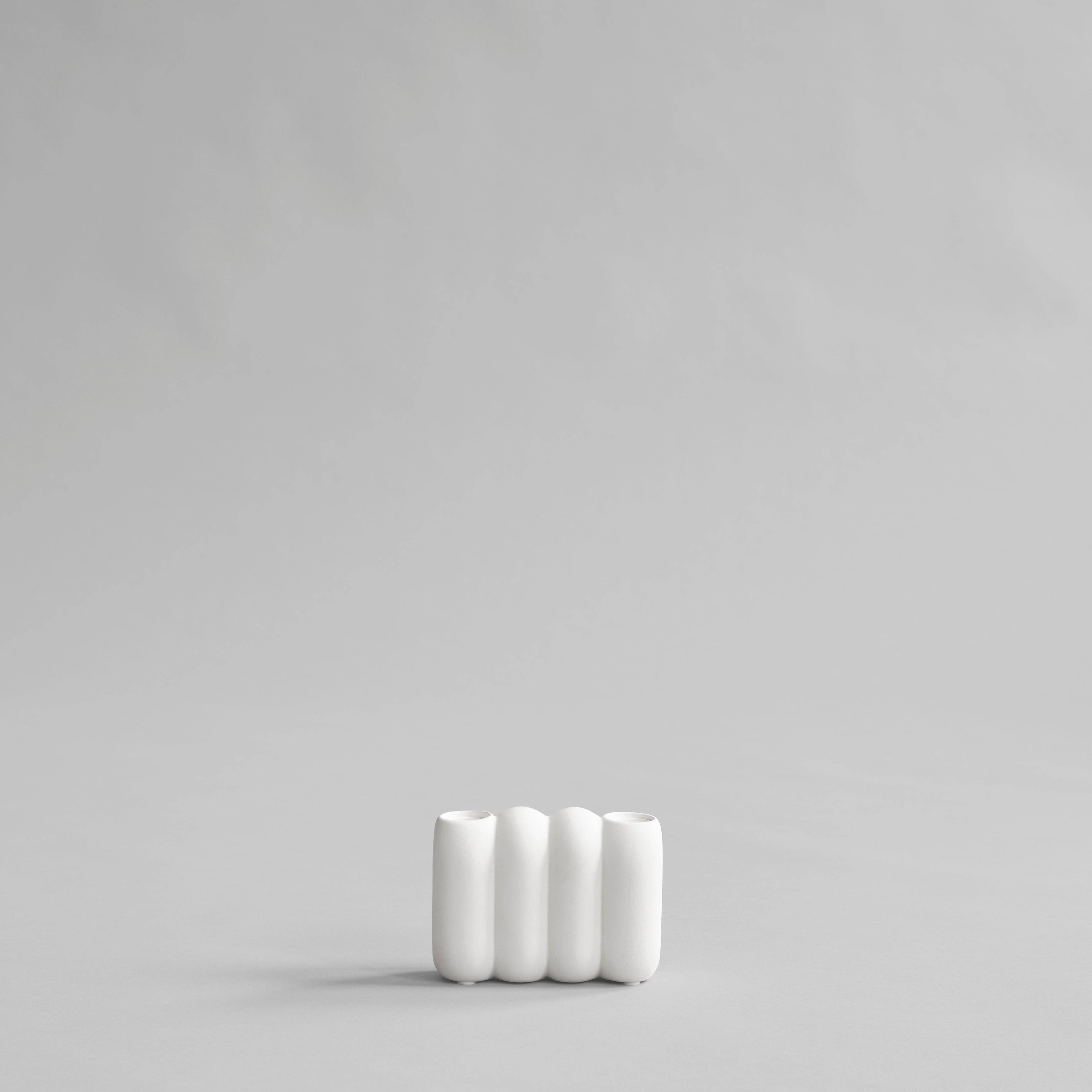 101 Copenhagen Tube Candleholder Mini in bone white hand-glazed ceramic with sculptural lamella design, holds two candles.