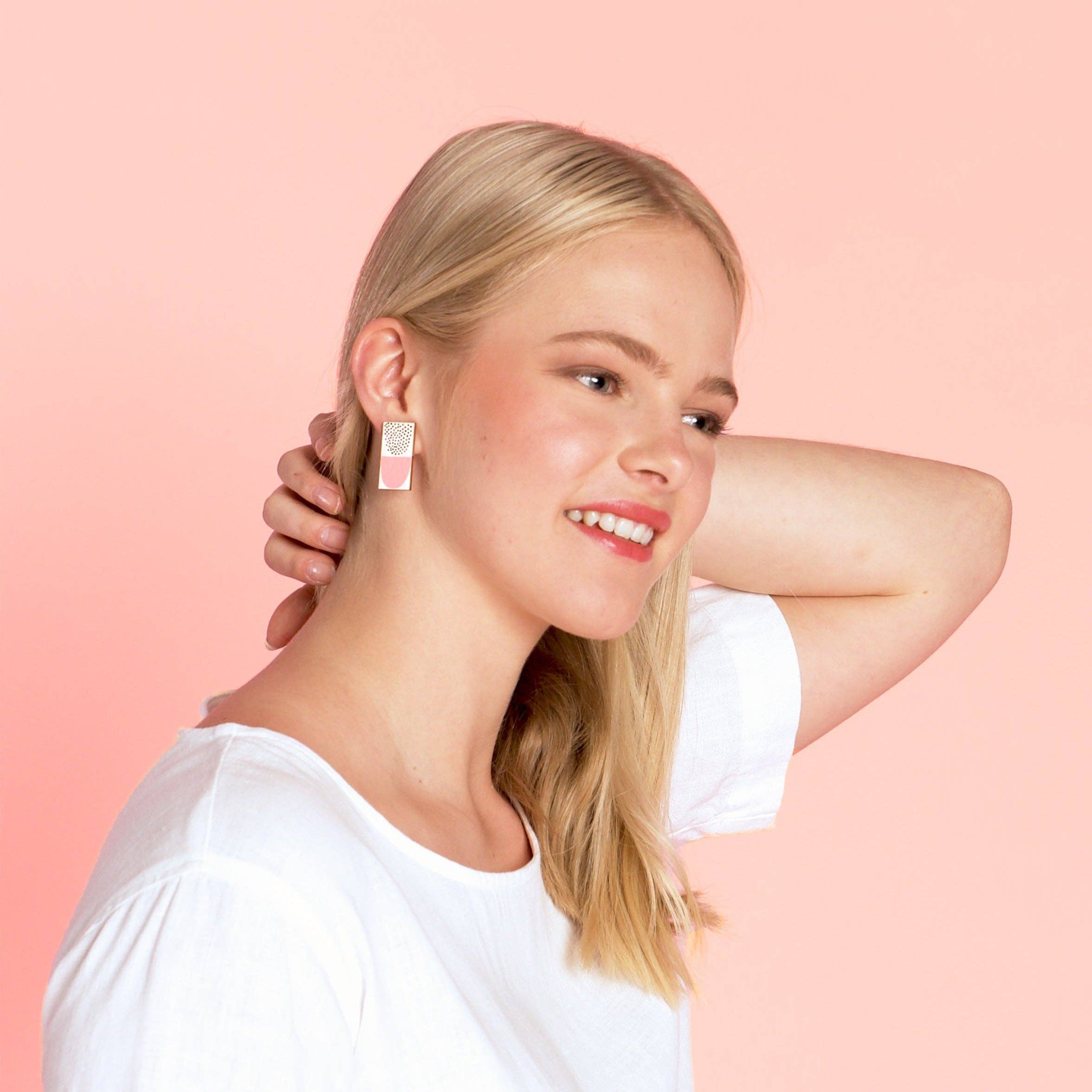 Kauniste Sokeri Big Earrings in pink and black polka-dot birch veneer, handmade in Finland.