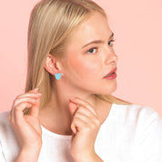 uniste Sokeri mismatched earrings in black and pink birch veneer, handmade in Finland.