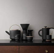Stelton Theo set in matte black stoneware by Francis Cayouette with glossy interior glaze, rustic yet modern Nordic coffee maker, 0.8L capacity.