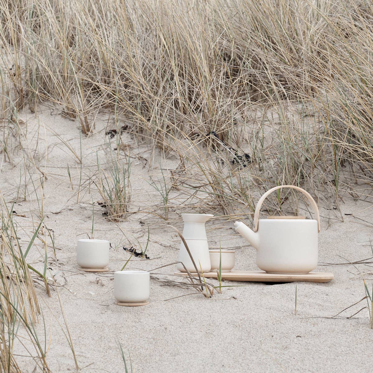 Stelton Theo Set in matte sand stoneware with glossy interior, designed by Francis Cayouette. Rustic yet modern Nordic.