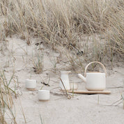 Stelton Theo Set in matte sand stoneware with glossy interior, designed by Francis Cayouette. Rustic yet modern Nordic.