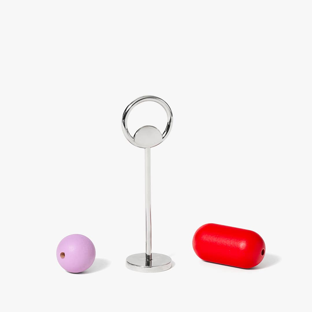 Areaware Abaco Bottle Opener with colorful wood beads on zinc alloy base, inspired by the abacus.
