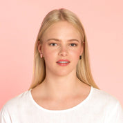 uniste Sokeri mismatched earrings in black and pink birch veneer, handmade in Finland.