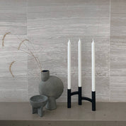 Stelton Ora Three-Branch Candleholder in black with organic sculptural design, holds three candles.