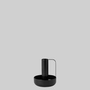 Ida Candle Holder in matte black powder-coated steel with handle and saucer base by Böttcher & Kayser.