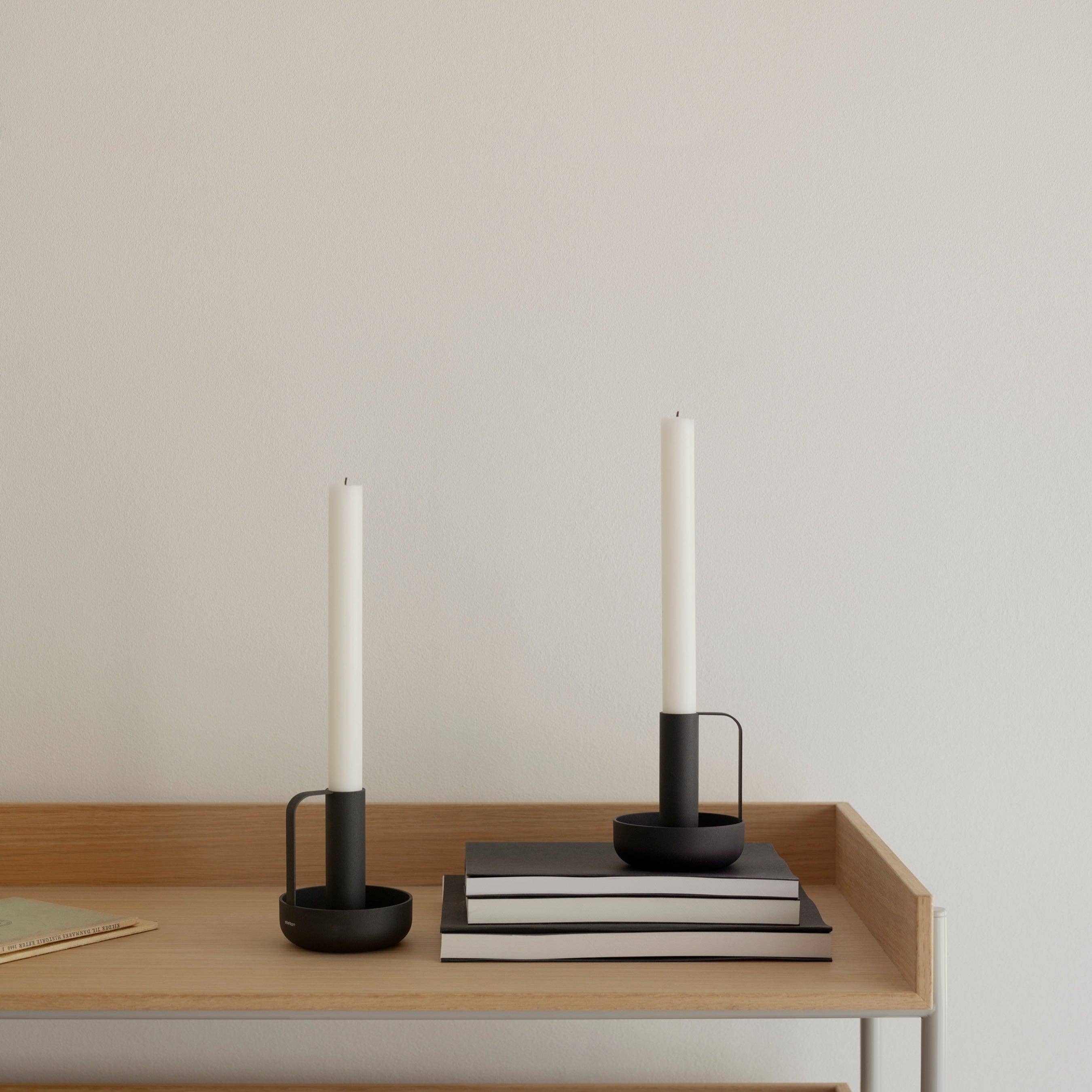 Ida Candle Holder in matte black powder-coated steel with handle and saucer base by Böttcher & Kayser.