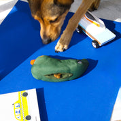 Colorful eco-friendly dog toy shaped like a bird, made from recycled PET bottles and Better Cotton™ fabric.