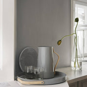 Stelton Emma Serving Tray and Pitcher in glossy light grey powder-coated steel with beechwood handles. Part of the Emma collection by HolmbäckNordentoft.