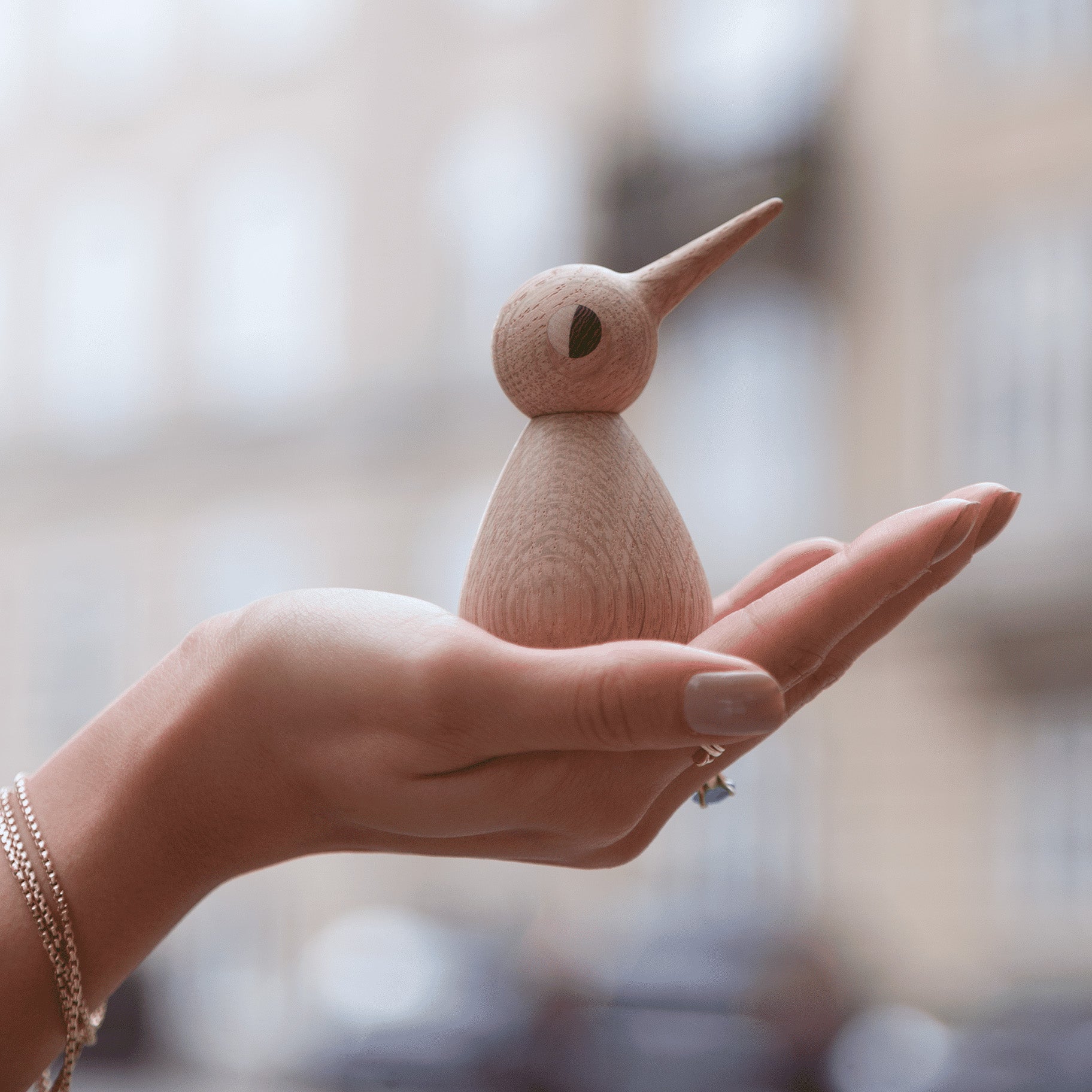 Architectmade BIRD by Kristian Vedel, handmade in oak with wenge and maple eyes, available in Small, Large, and Chubby sizes.