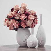 Architectmade Flow Vases in white porcelain, designed by Vibeke Rytter. Inspired by water ripples and Copenhagen’s Grundtvig’s Church.