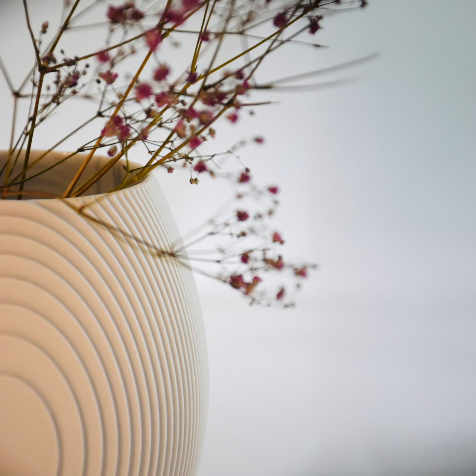 Architectmade Flow Vases in white porcelain, designed by Vibeke Rytter. Inspired by water ripples and Copenhagen’s Grundtvig’s Church.