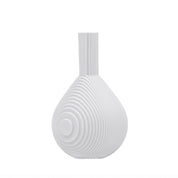 Architectmade Flow Vases in white porcelain, designed by Vibeke Rytter. Inspired by water ripples and Copenhagen’s Grundtvig’s Church.