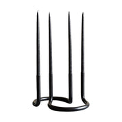 Pair of Architectmade Gemini candleholders interlocked in black and white, glowing with taper candles and bundle savings.