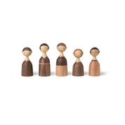 Architectmade Kin figurines by Lars Beller Fjetland, handmade in walnut, mahogany, and maple with tilting heads, shown in a mix-and-match constellation.