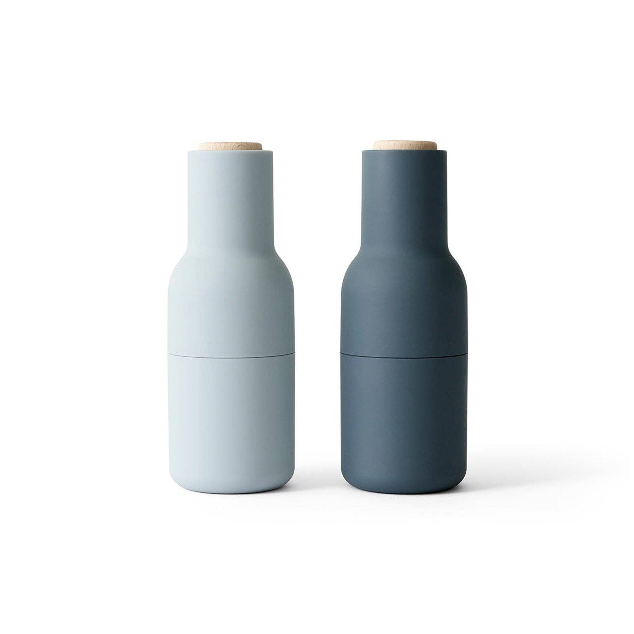 Audo Copenhagen Bottle Grinder in bottle-shaped form with beech lid. Minimal Nordic salt and pepper mill with inverted, mess-free design.