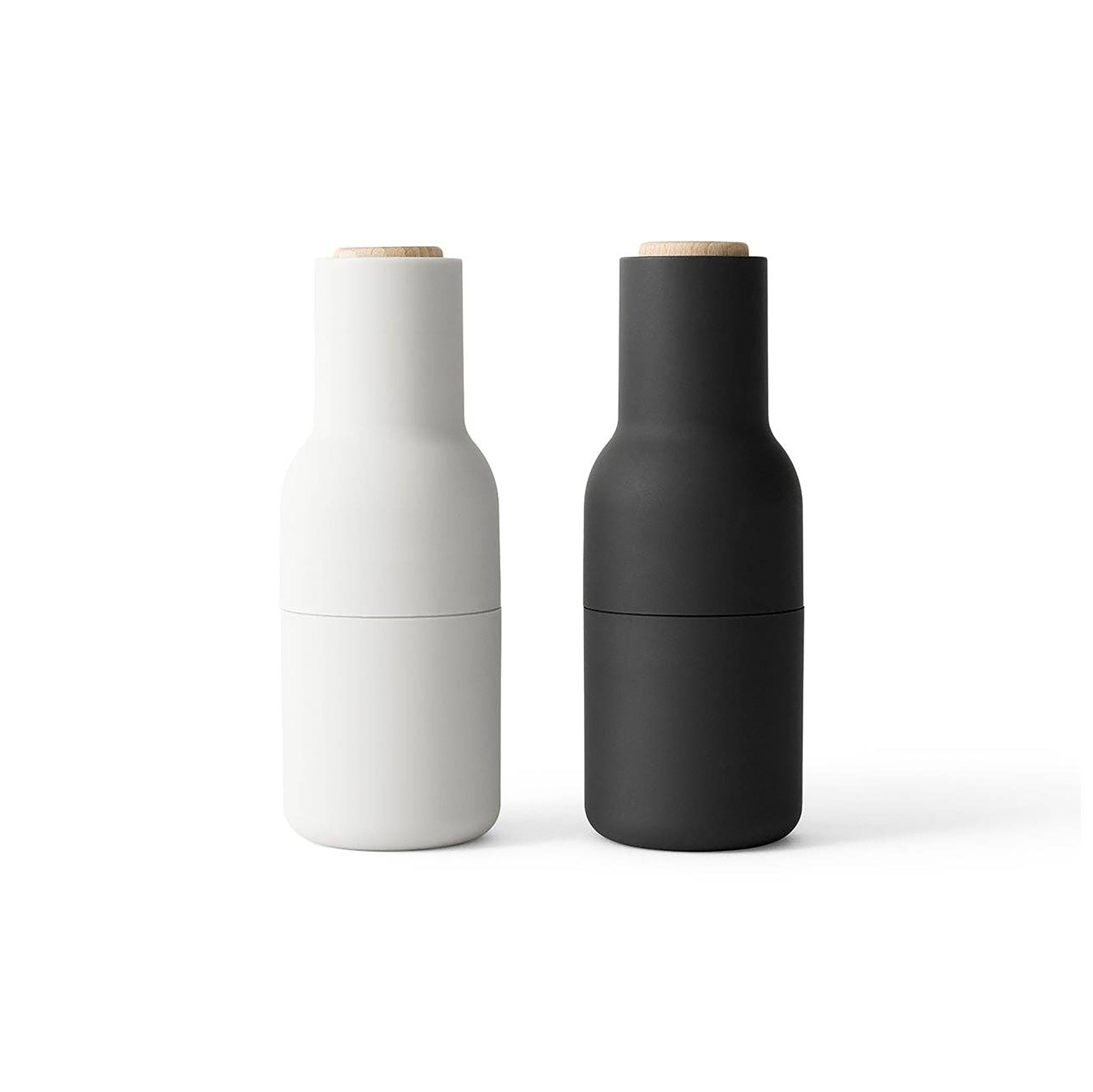 Audo Copenhagen Bottle Grinder in bottle-shaped form with beech lid. Minimal Nordic salt and pepper mill with inverted, mess-free design.
