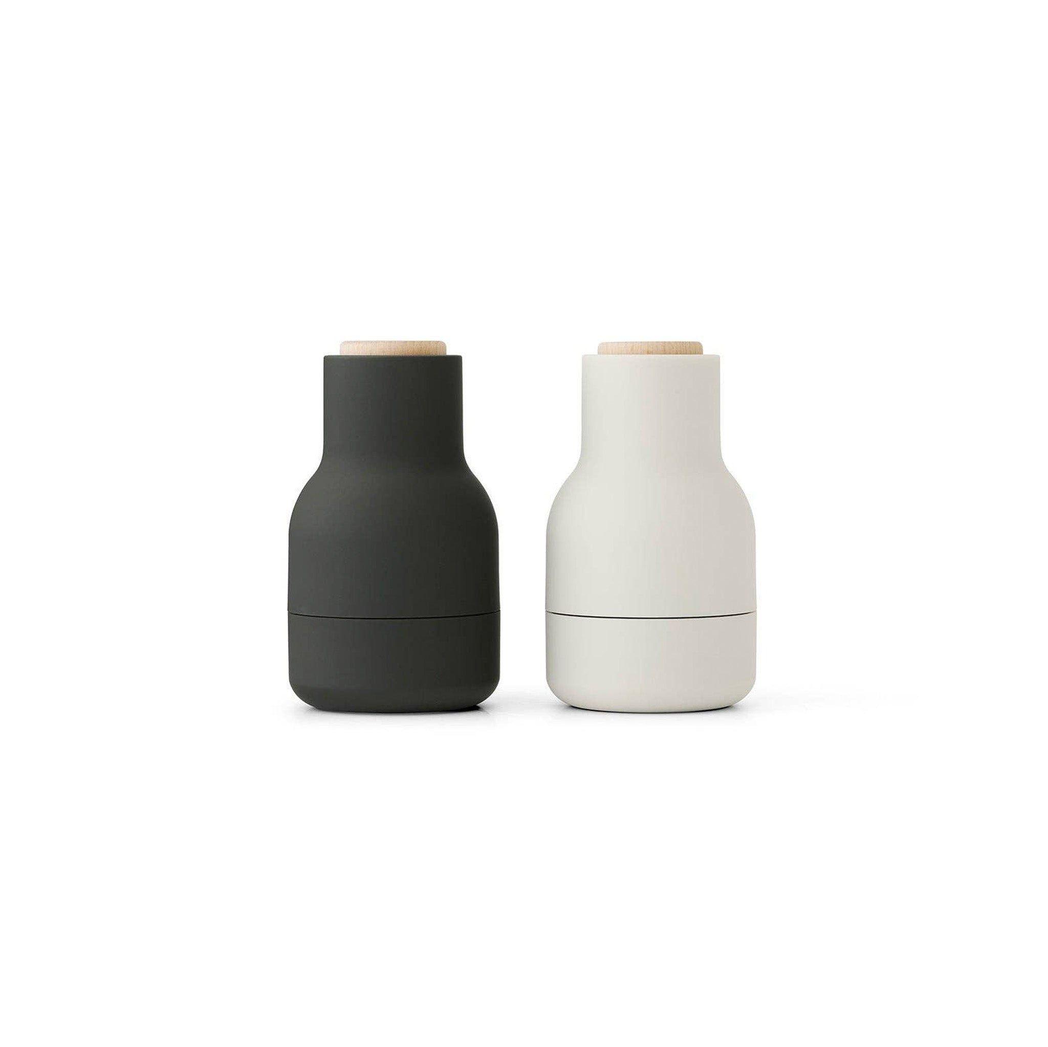 Audo Copenhagen Small Bottle Grinder in bottle-shaped form with beech lid. Compact Nordic salt and pepper mill with inverted, mess-free design.