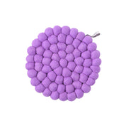 Aveva Design Round Wool Trivet, handmade wool circle design in multiple colors. Protects tables with playful style.