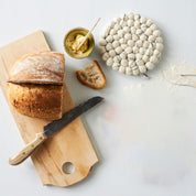 Aveva Design Round Wool Trivet, handmade wool circle design in multiple colors. Protects tables with playful style.