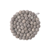 Aveva Design Round Wool Trivet, handmade wool circle design in multiple colors. Protects tables with playful style.