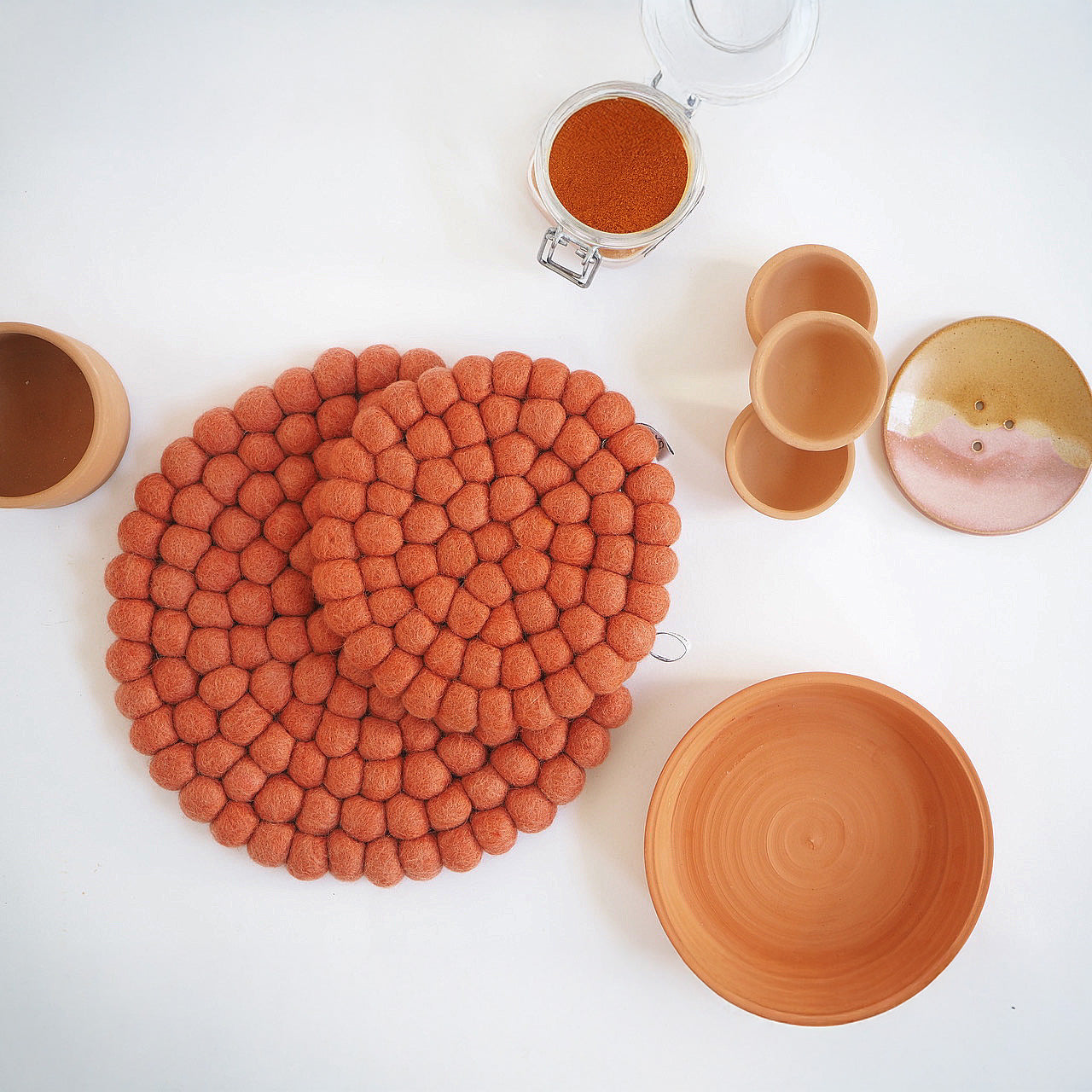 Aveva Design Round Wool Trivet, handmade wool circle design in multiple colors. Protects tables with playful style.