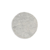 Aveva Seat Cushion in wool felt, available in raw grey or graphic patterns. Round portable chair pads in two sizes, designed in Sweden.