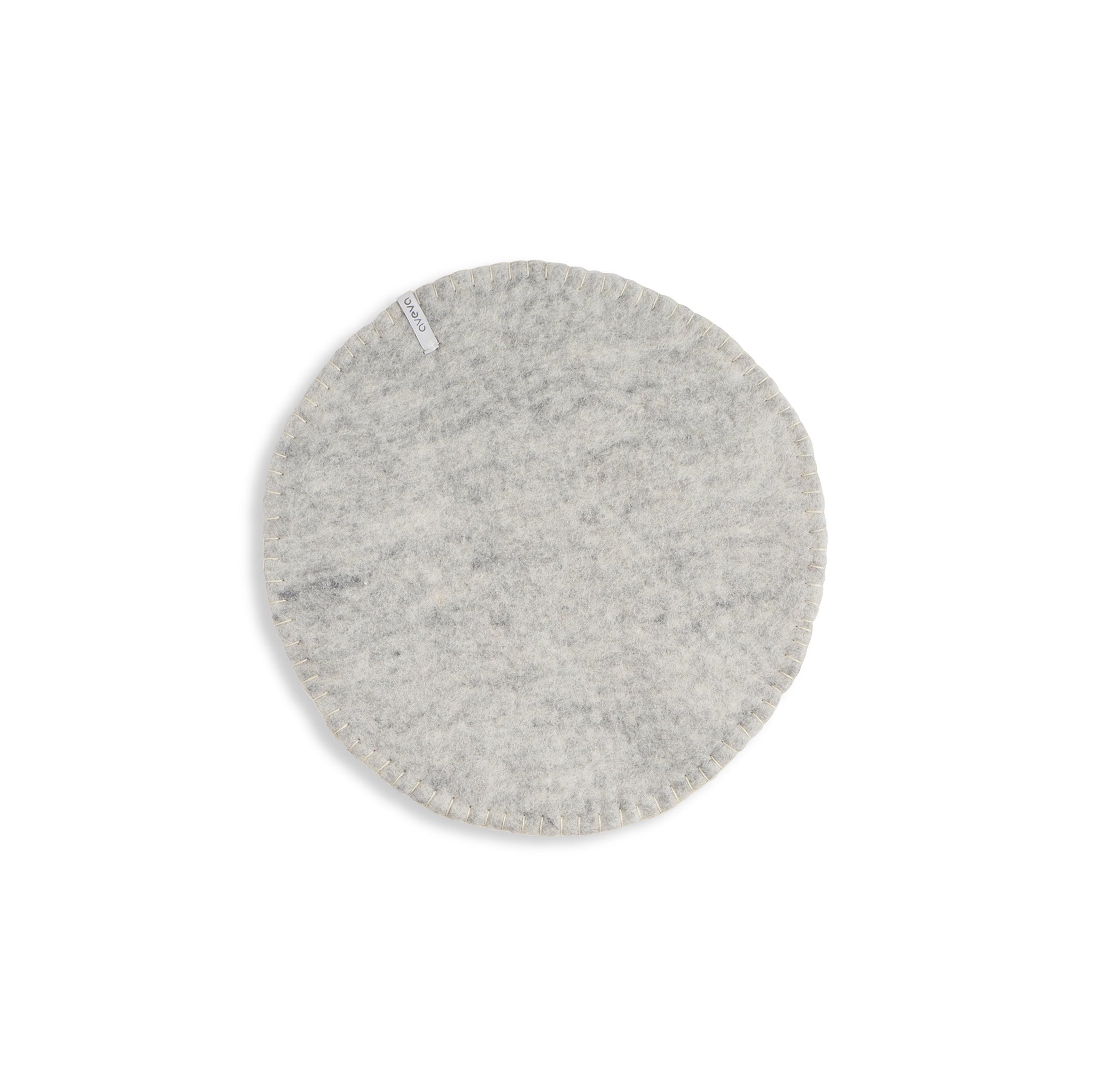Aveva Seat Cushion in wool felt, available in raw grey or graphic patterns. Round portable chair pads in two sizes, designed in Sweden.