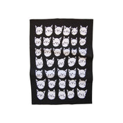 Many Cats Tea Towel, 100% cotton with black background and white cat faces, 50 × 70 cm. Designed in Canada, made in India.