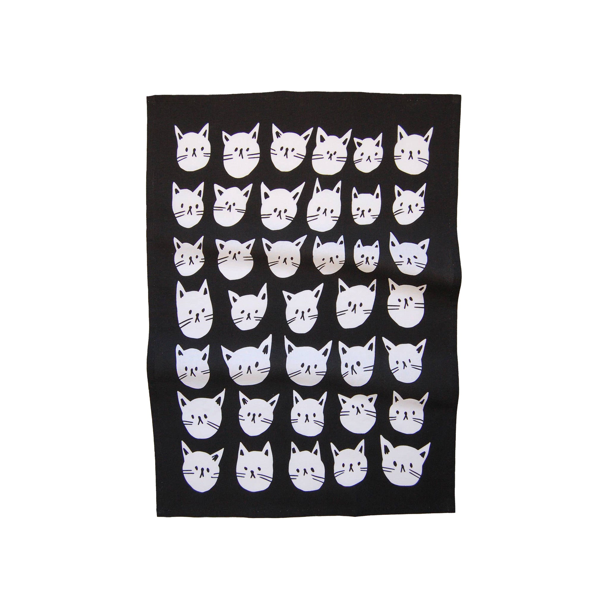Many Cats Tea Towel, 100% cotton with black background and white cat faces, 50 × 70 cm. Designed in Canada, made in India.