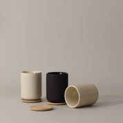 Stelton Theo Thermo Cup with bamboo coaster, available in matte black or sand stoneware with glossy interior, designed by Francis Cayouette. 0.25 L Nordic mug.
