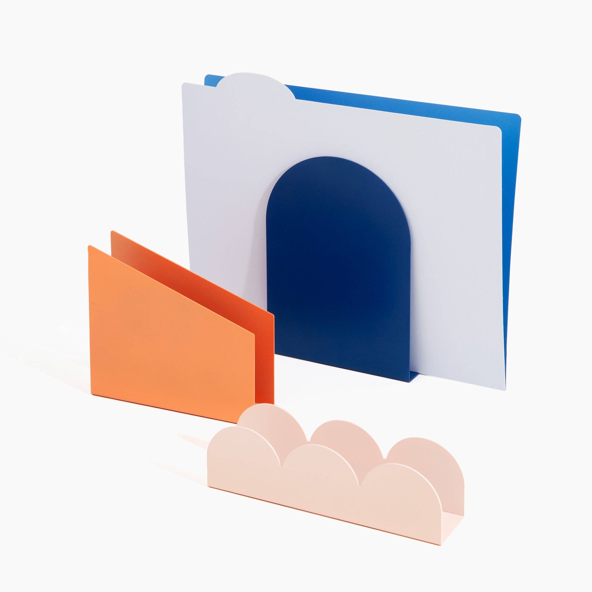 Poketo Forms Desk Organizer Set of 3 in blue dome, coral slant, and pink scallop shapes. Hand-painted metal organizers for stylish desks.