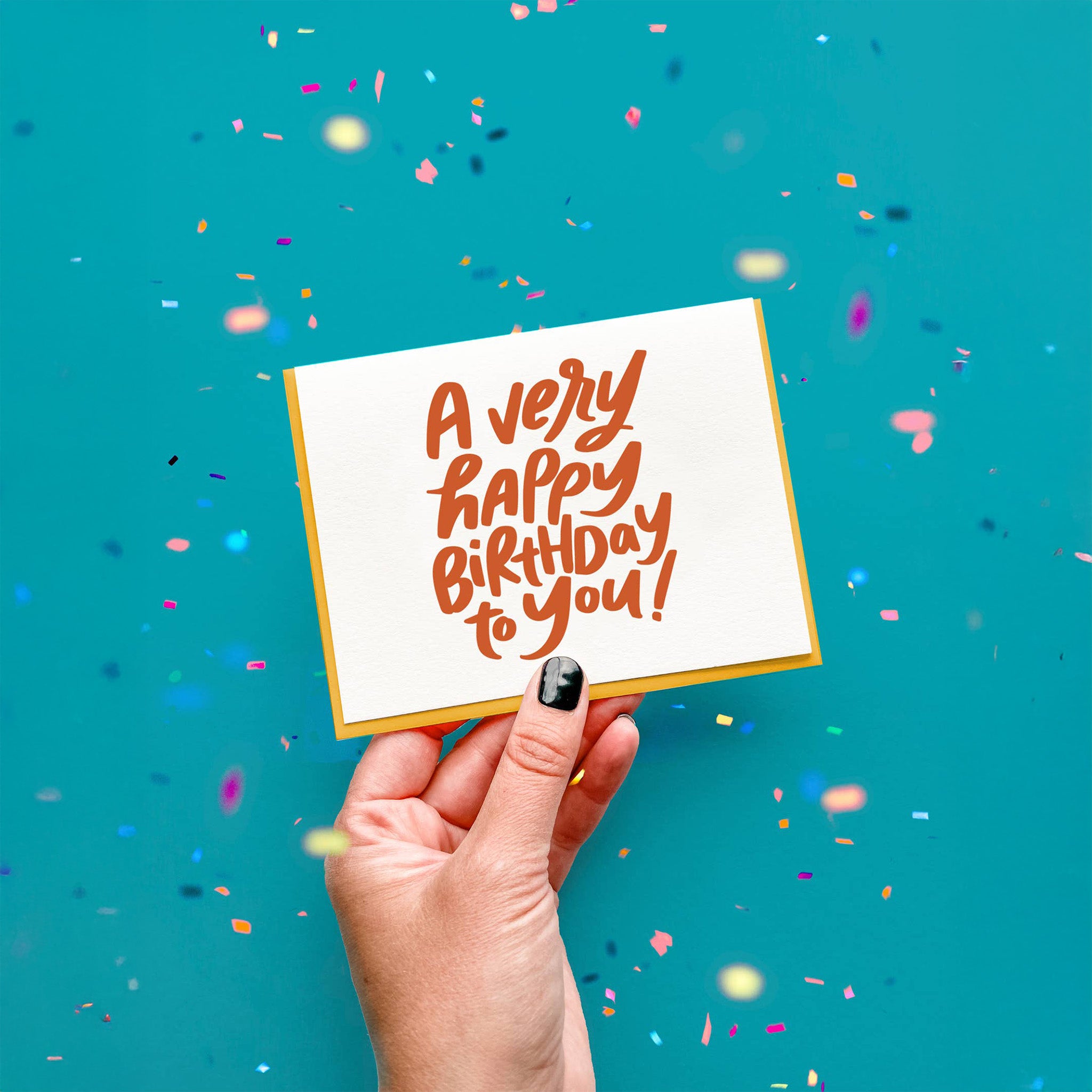Dahlia Press Very HBD Card with oversized hand-lettered text “A Very Happy Birthday to You!” in orange. Letterpress printed on cotton paper, blank inside, 4.25 × 5.5", envelope included.