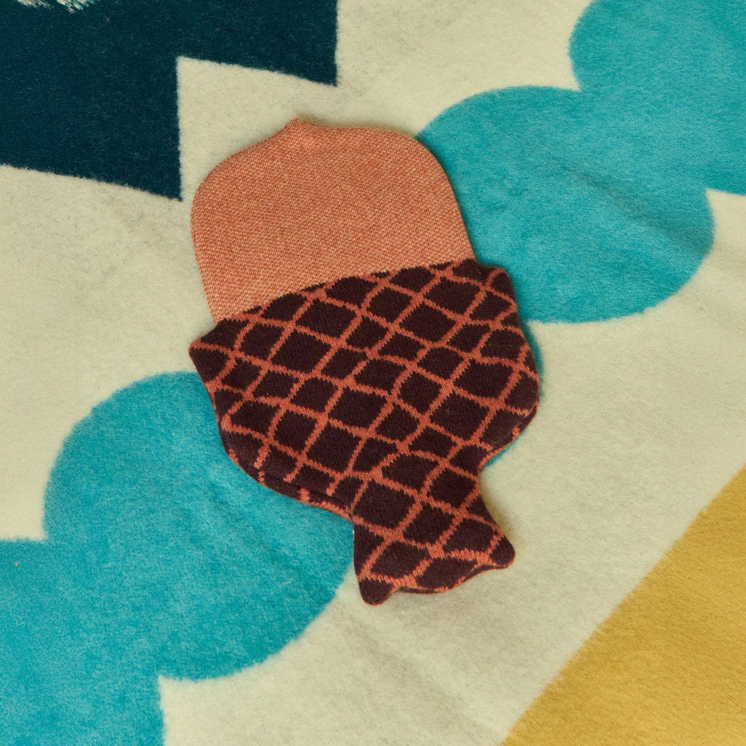 Donna Wilson Acorn Hot Water Bottle with knitted lambswool cover, cozy hot water bottle for warmth and comfort.