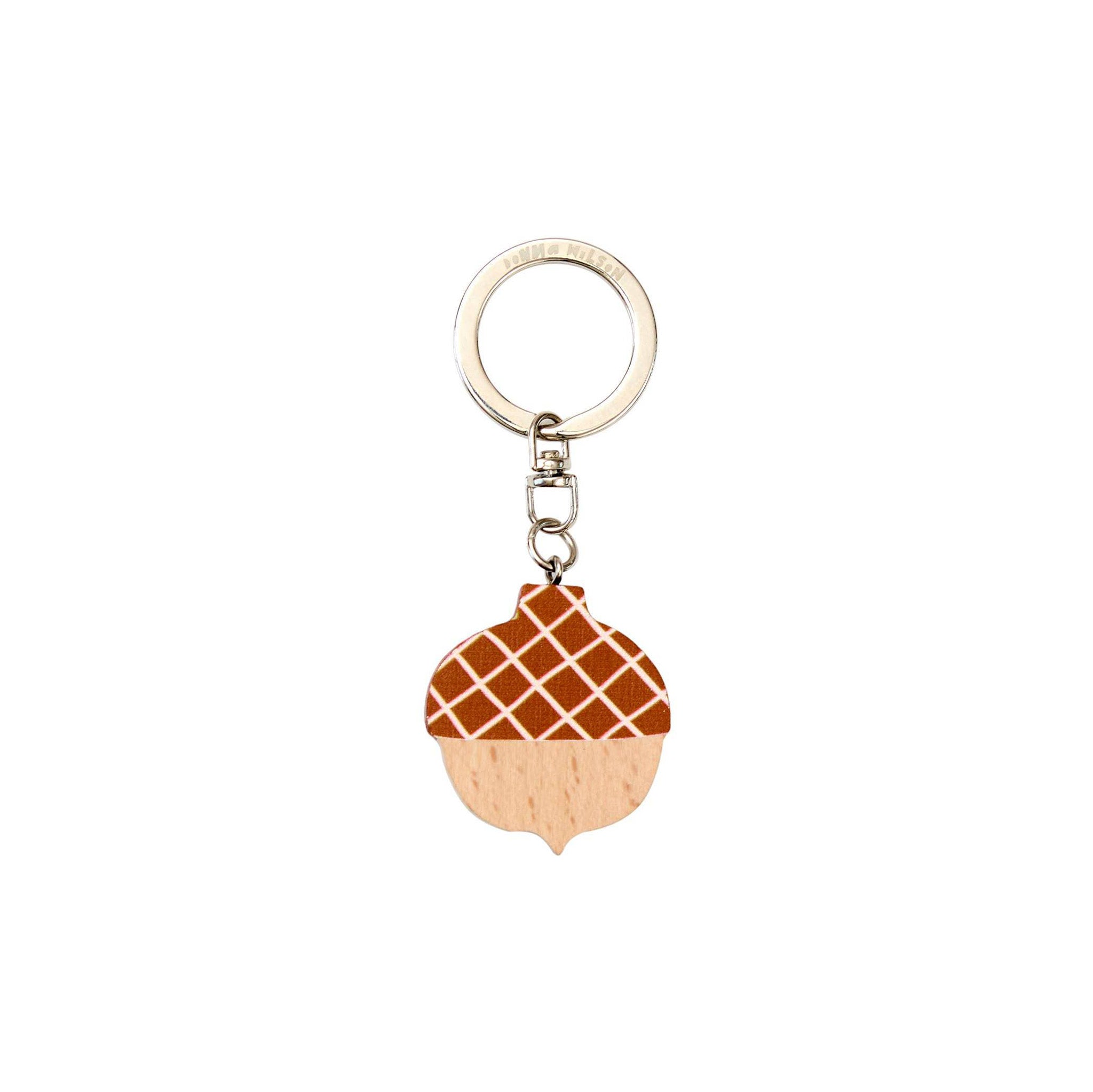 Donna Wilson Acorn Keyring in FSC wood, acorn-shaped design with metal ring. Fun, durable, and pocket-sized key charm.
