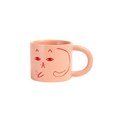 Donna Wilson candy-pink ceramic Cat Mug with debossed cat images, tactile coffee or tea mug.