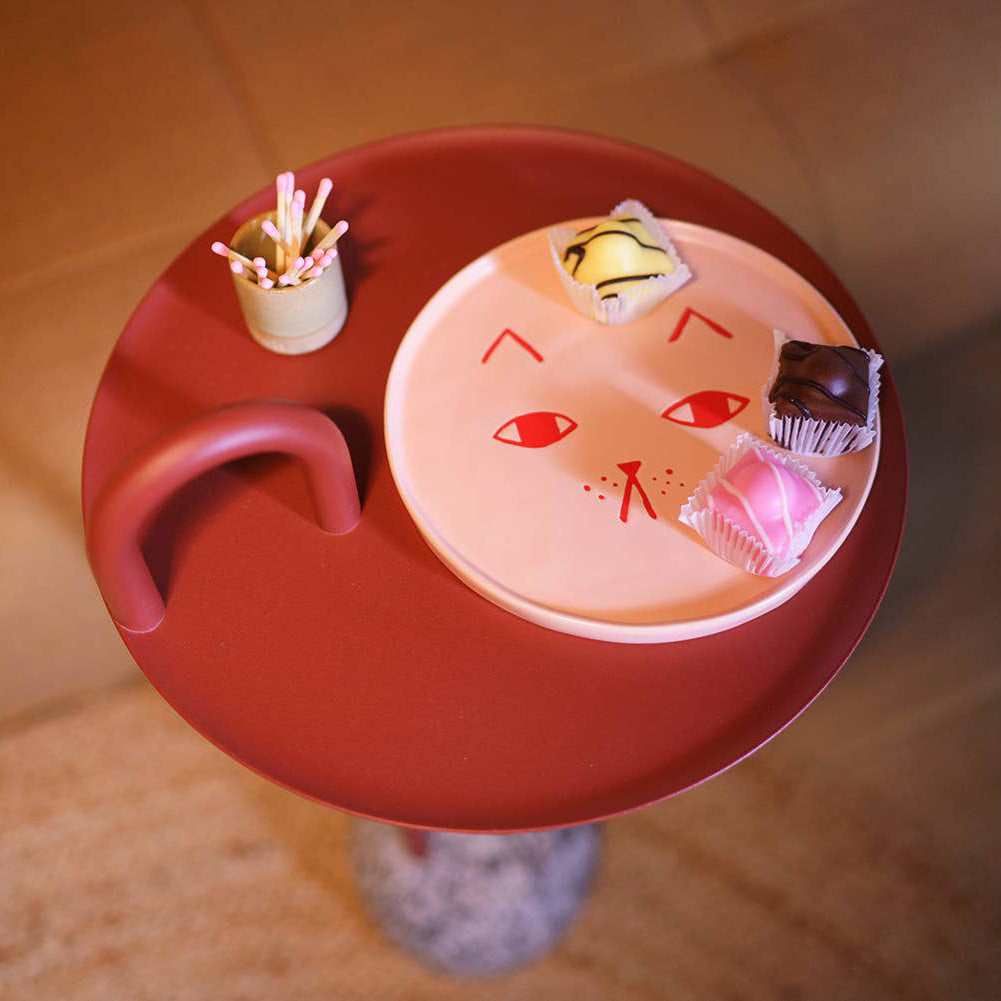 Donna Wilson Cat Side Plate in candy-pink ceramic with glazed cat face, playful plate for serving snacks or hanging as wall art.