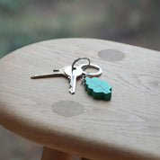 Donna Wilson Leaf Keyring in oak-leaf design, FSC wood charm with sturdy metal ring for keys or bags.
