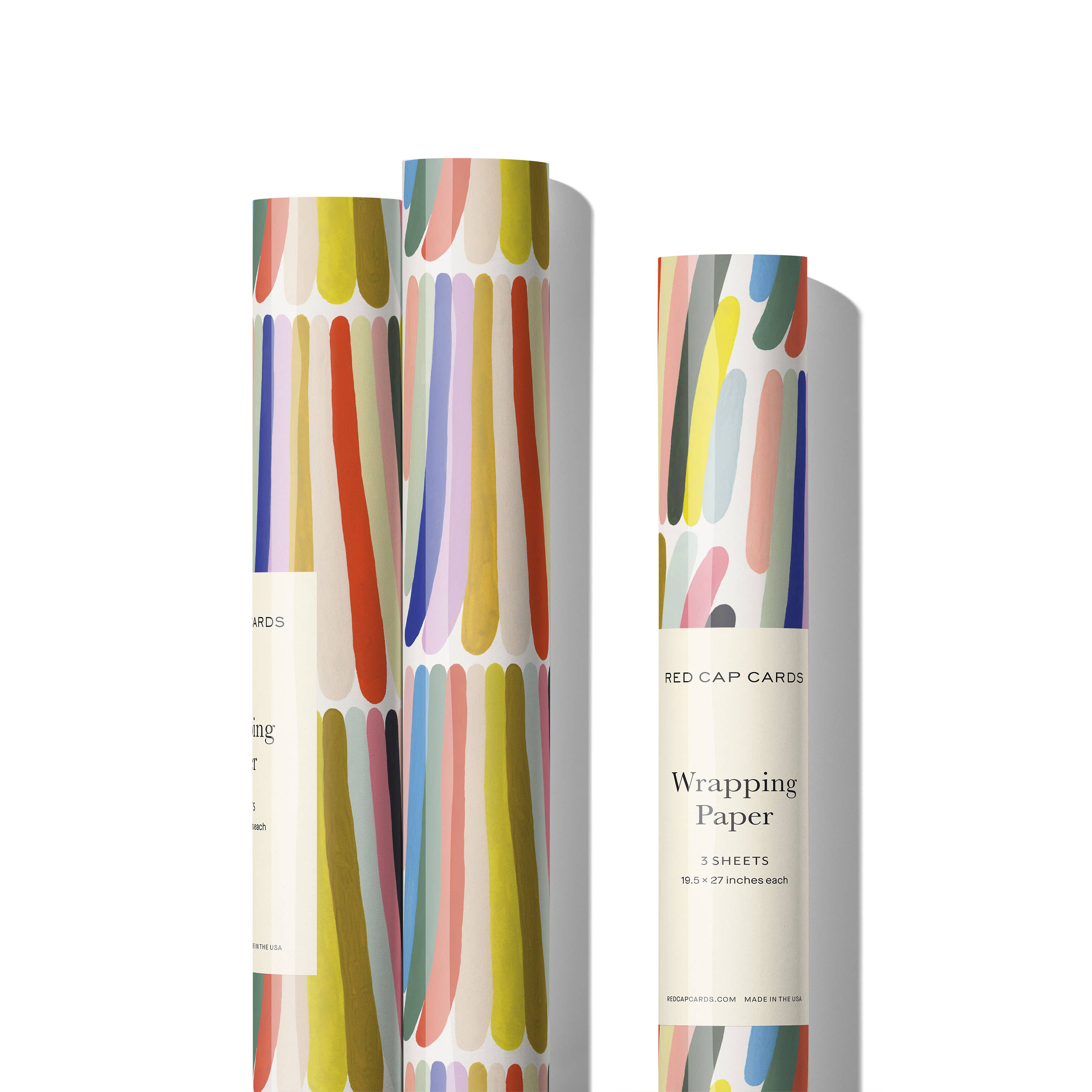 Red Cap Cards Rainbow Stripes Wrapping Paper, illustrated by Kate Pugsley. Bright rainbow gift wrap, recycled paper set of 3 rolled sheets, 19 × 27 inches.