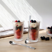 Stelton Pilastro Large Drinking Glass Set of 4 in clear machine-blown glass. Art Déco–style Nordic glasses for hot or cold drinks, stackable and sturdy.