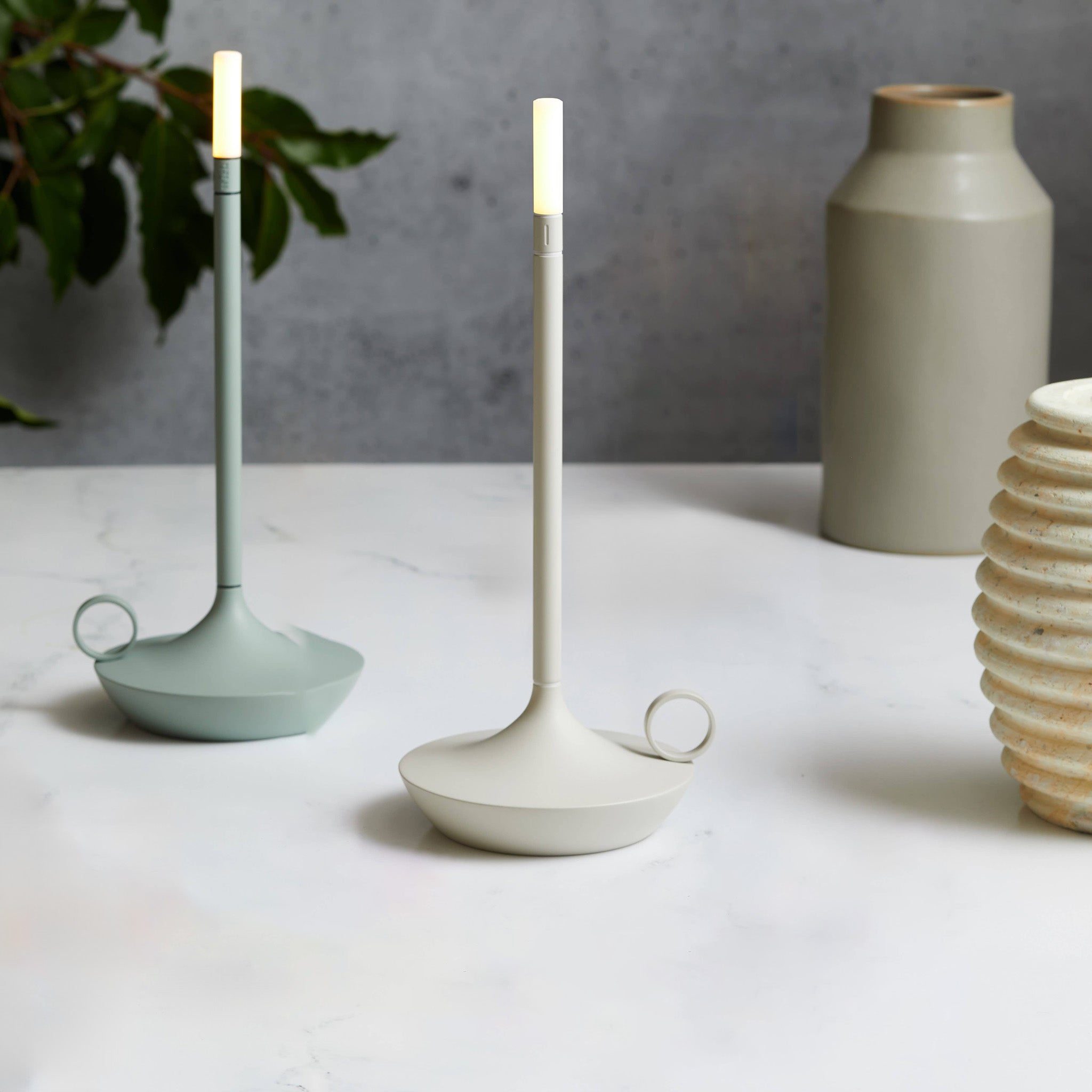 Graypants Wick Portable Rechargeable Candle Lamp in plated aluminum with warm white LED glow. Cordless, USB-C rechargeable, gift pack included.