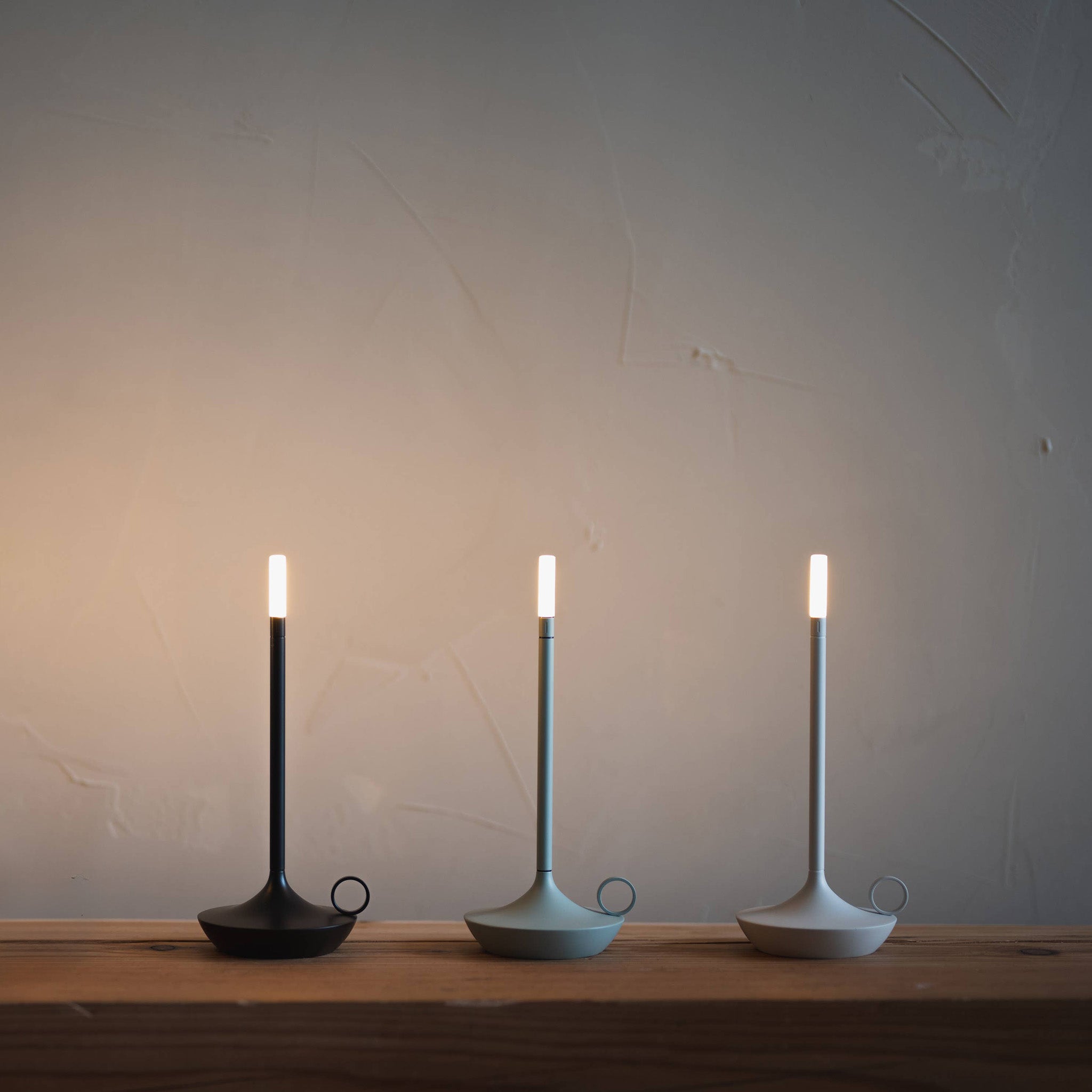 Graypants Wick Portable Rechargeable Candle Lamp in plated aluminum with warm white LED glow. Cordless, USB-C rechargeable, gift pack included.