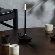 Graypants Wick Portable Rechargeable Candle Lamp in plated aluminum with warm white LED glow. Cordless, USB-C rechargeable, gift pack included.