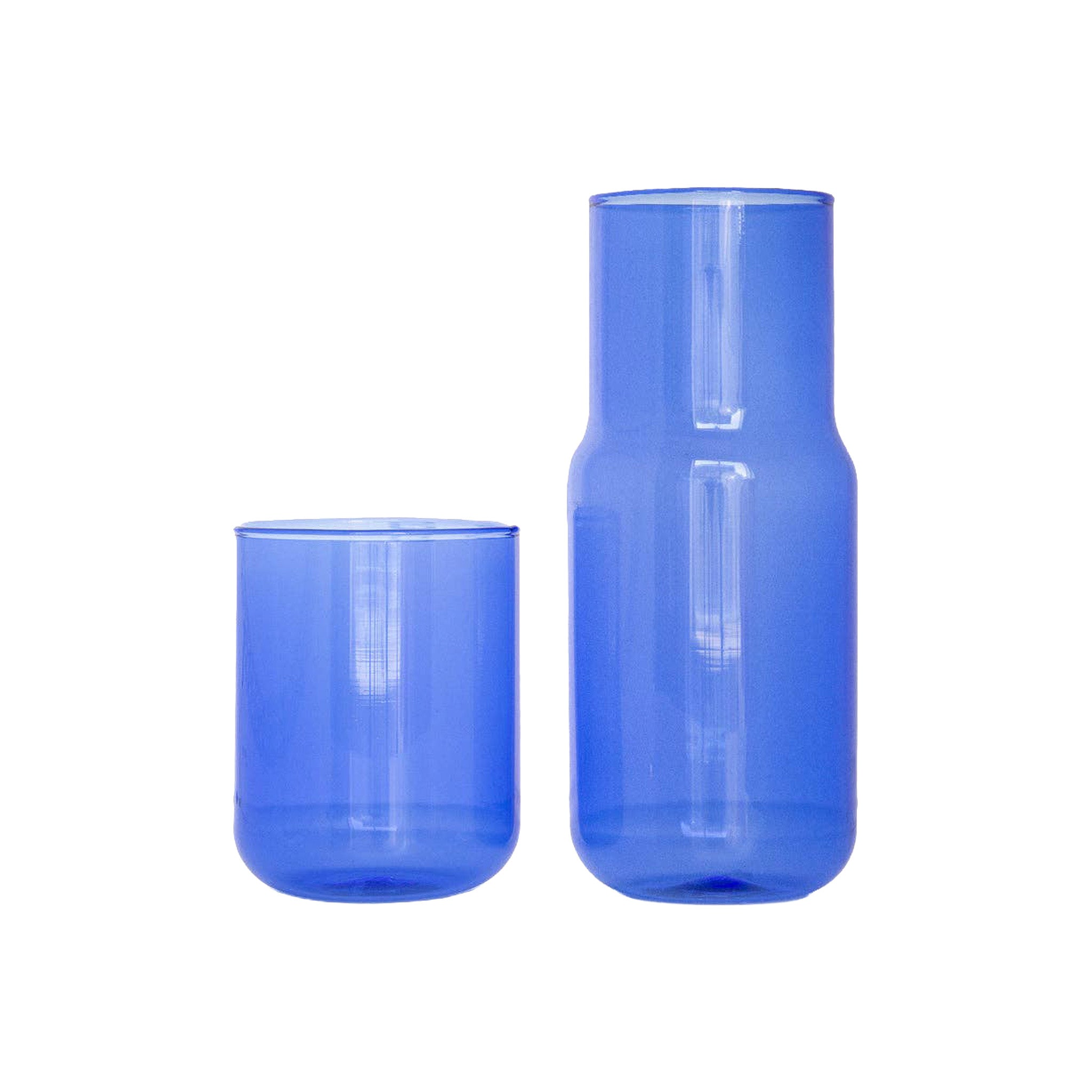Gry Matter Tinted Glass Carafe and stackable cup in Pool blue borosilicate glass with smooth, minimalist design.