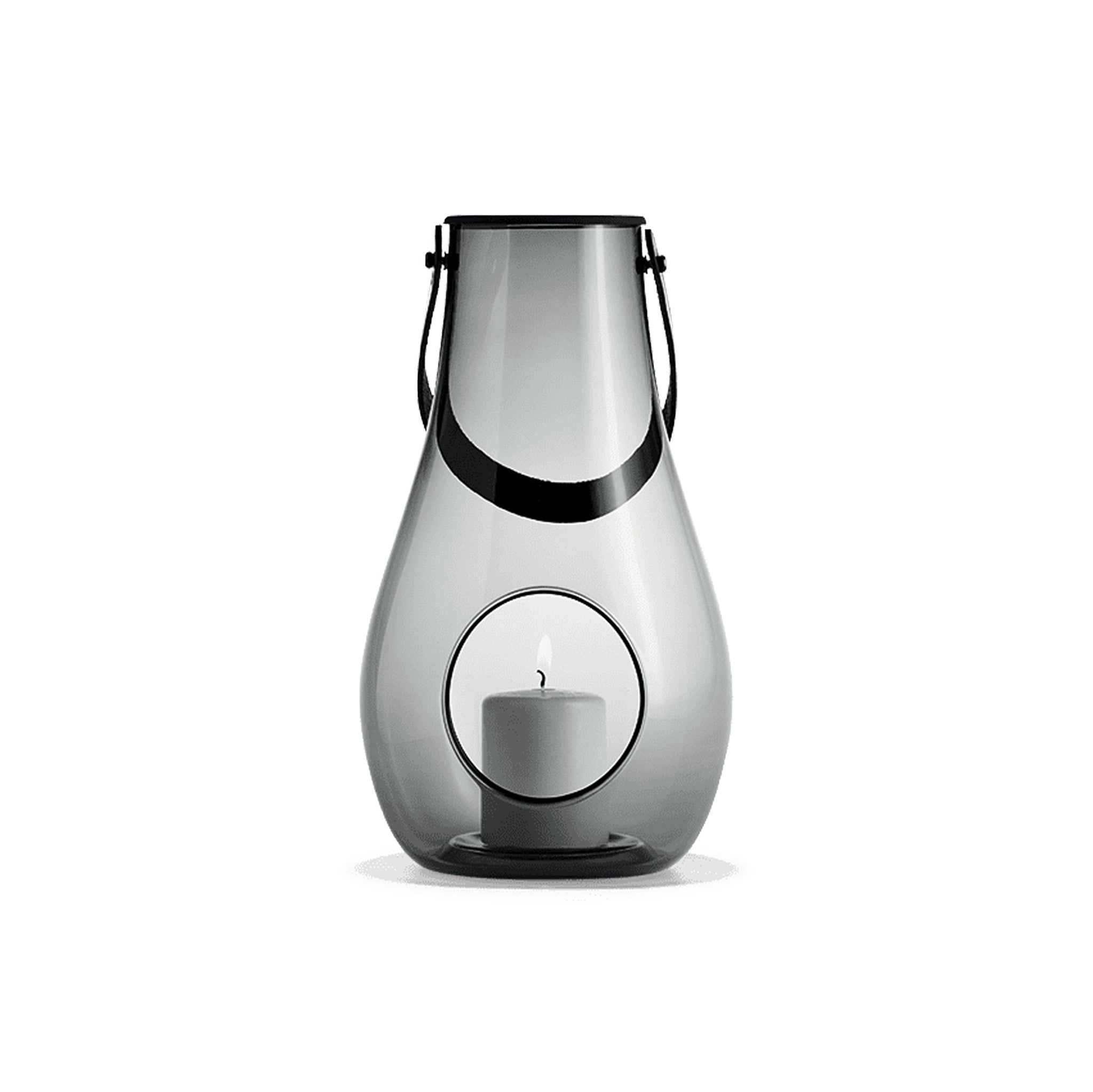 Holmegaard Design With Light H29 mouth-blown glass lantern with full-grain leather strap by Maria Berntsen, available in clear or smoke, 11.4 inches tall.