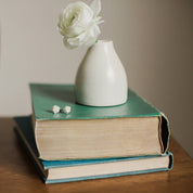 White porcelain faceted stud earrings handmade by designer Jenna Vanden Brink, minimalist everyday studs with titanium backs