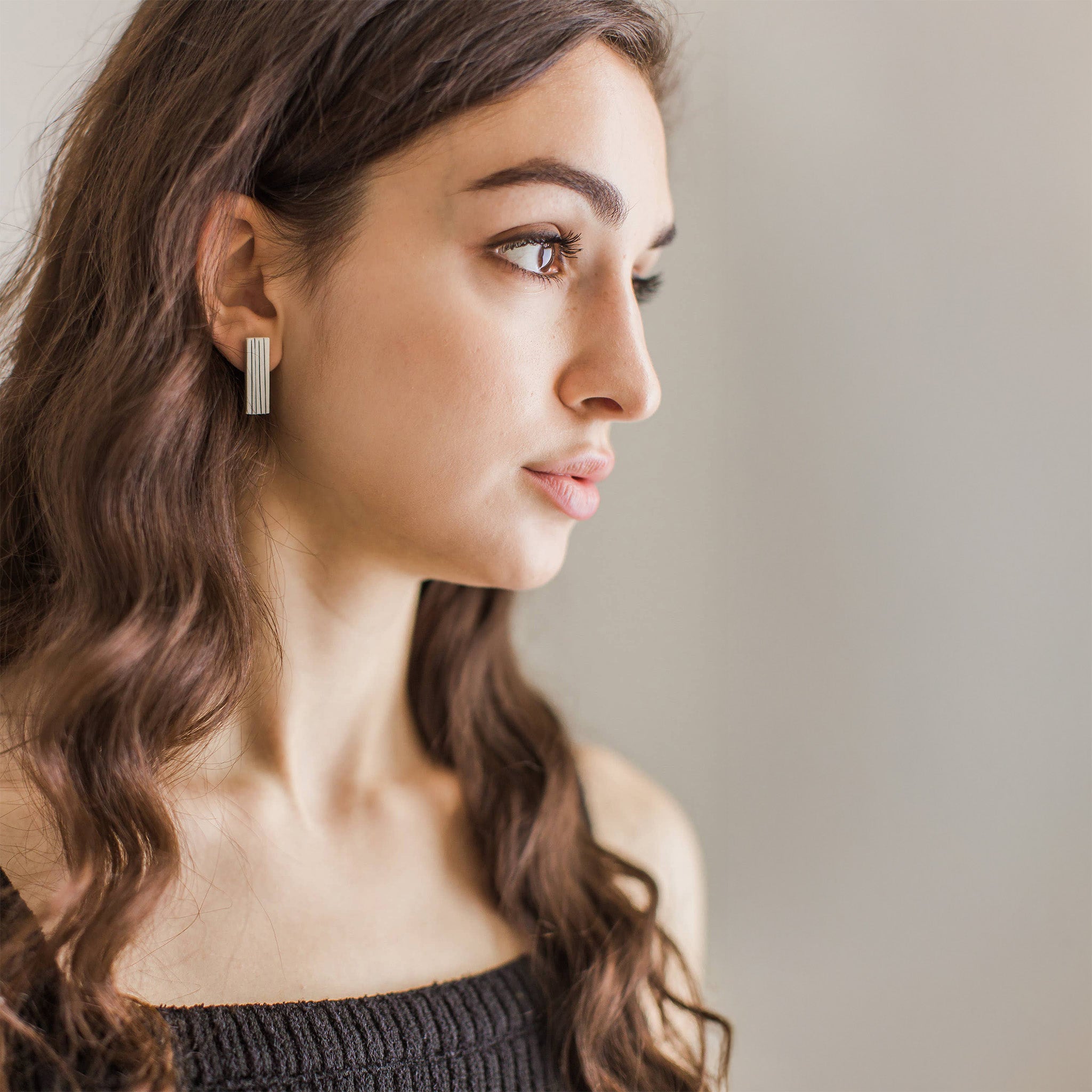 Black and white porcelain pinstripe bar stud earrings handmade by Jenna Vanden Brink, pinstripe swagger without the stiff suit, titanium posts