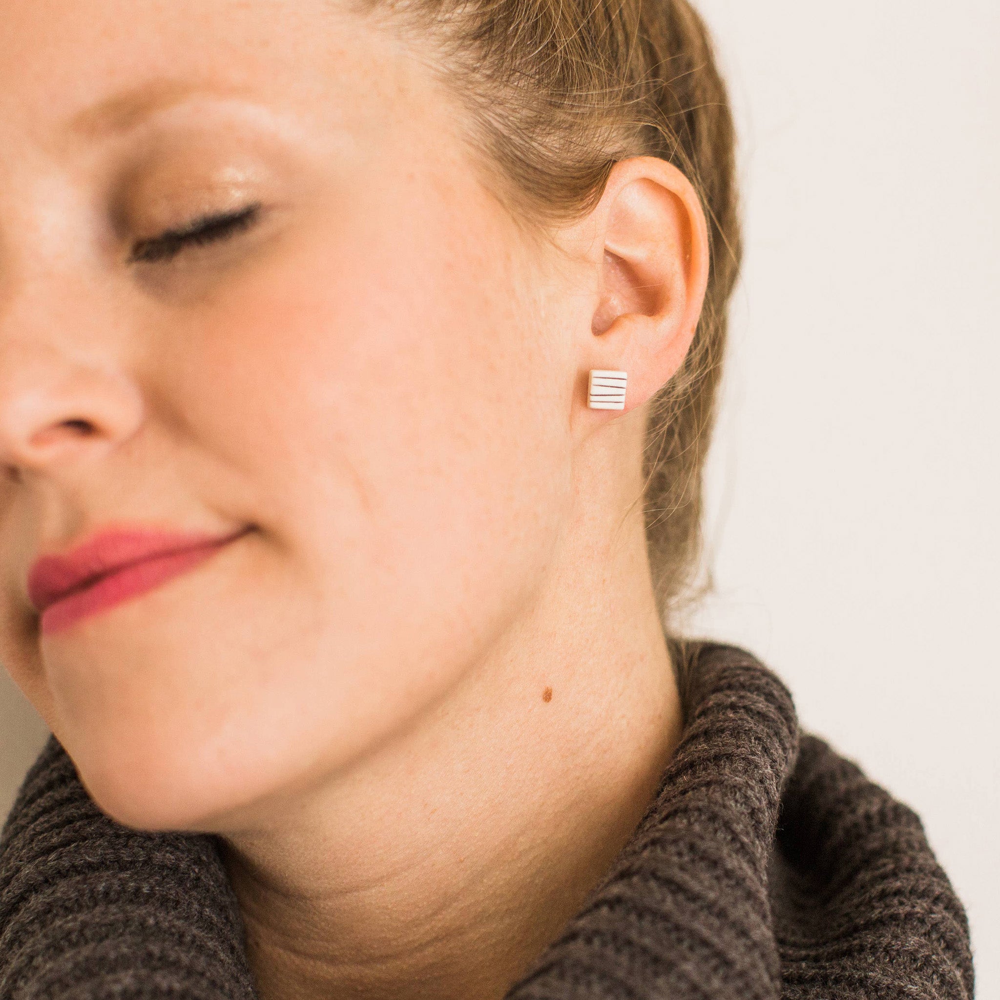 Porcelain pinstripe square stud earrings by Jenna Vanden Brink, ¼″ black & white handmade studs with hypoallergenic titanium hardware